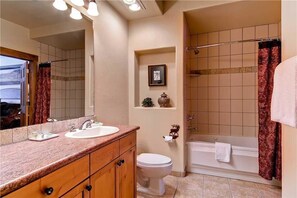A bathroom with a sink, toilet, and bathtub. - 2109 Timberline Lodge, Trappeur's Crossing Apartment 1 (Steamboat Springs)