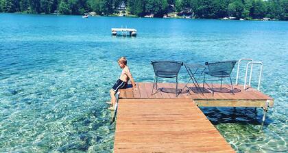 Relaxing Waterfront Cabin Located On A Sandy Bottom Crystal Clear Lake.