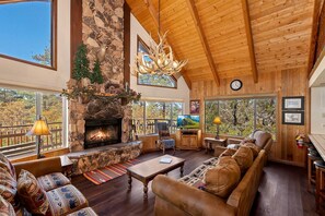 Télévision, cheminée, lecteur de DVD, baby-foot
