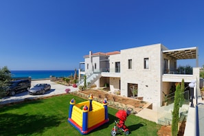 Situated in a residential area, this house offers a clear view of the ocean.