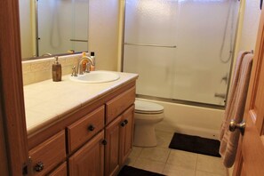 Bathtub, towels, soap, shampoo