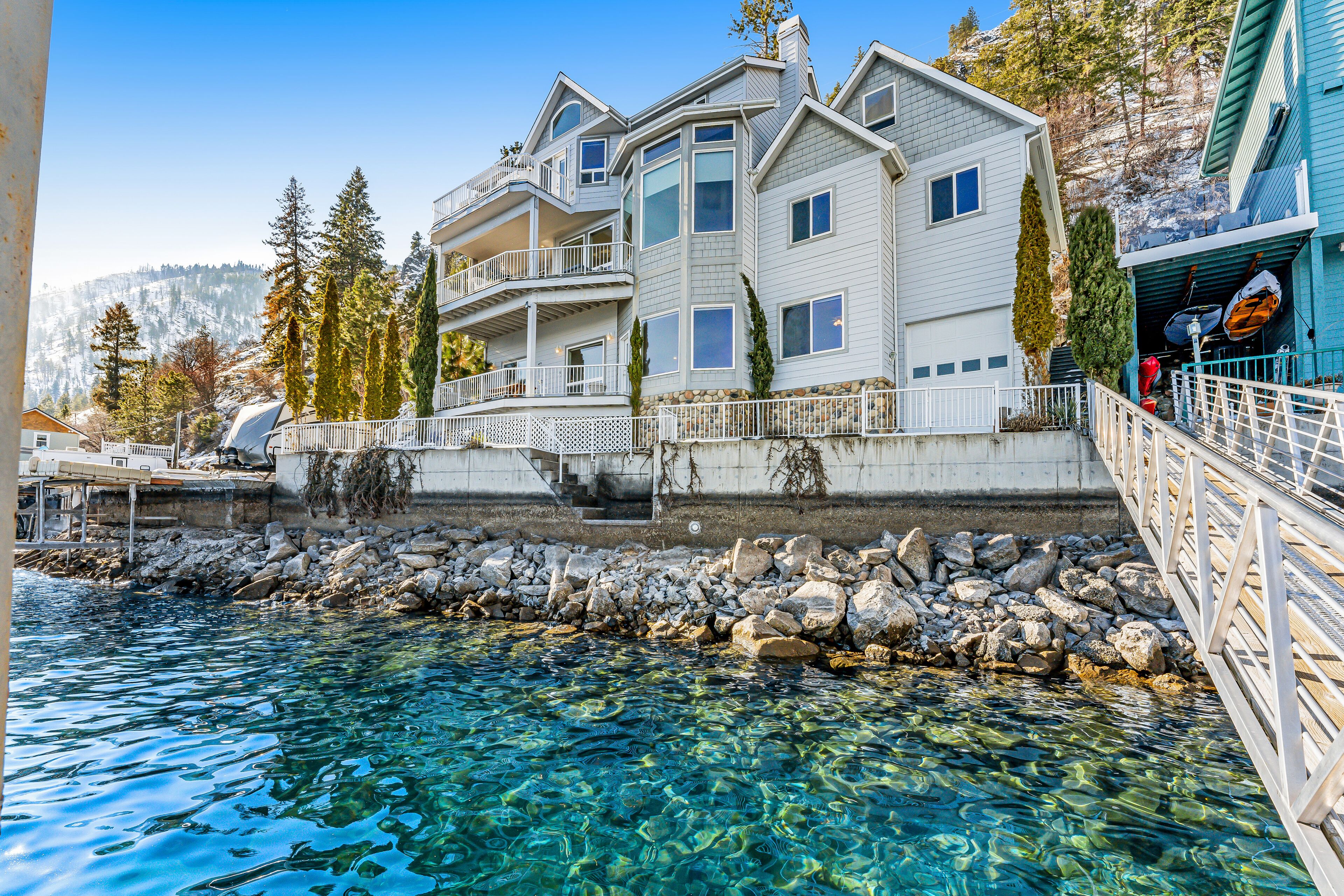 Upscale lakefront house with stunning views & dock spacious interior with fireplace