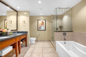 A modern bathroom with a large mirror, a bathtub, a shower, and a toilet. - Honua Kai | Ocean View 2 BR | Family friendly | Car Incl. w/ 6+ Nights | HKH-242 by KBM (Lahaina)