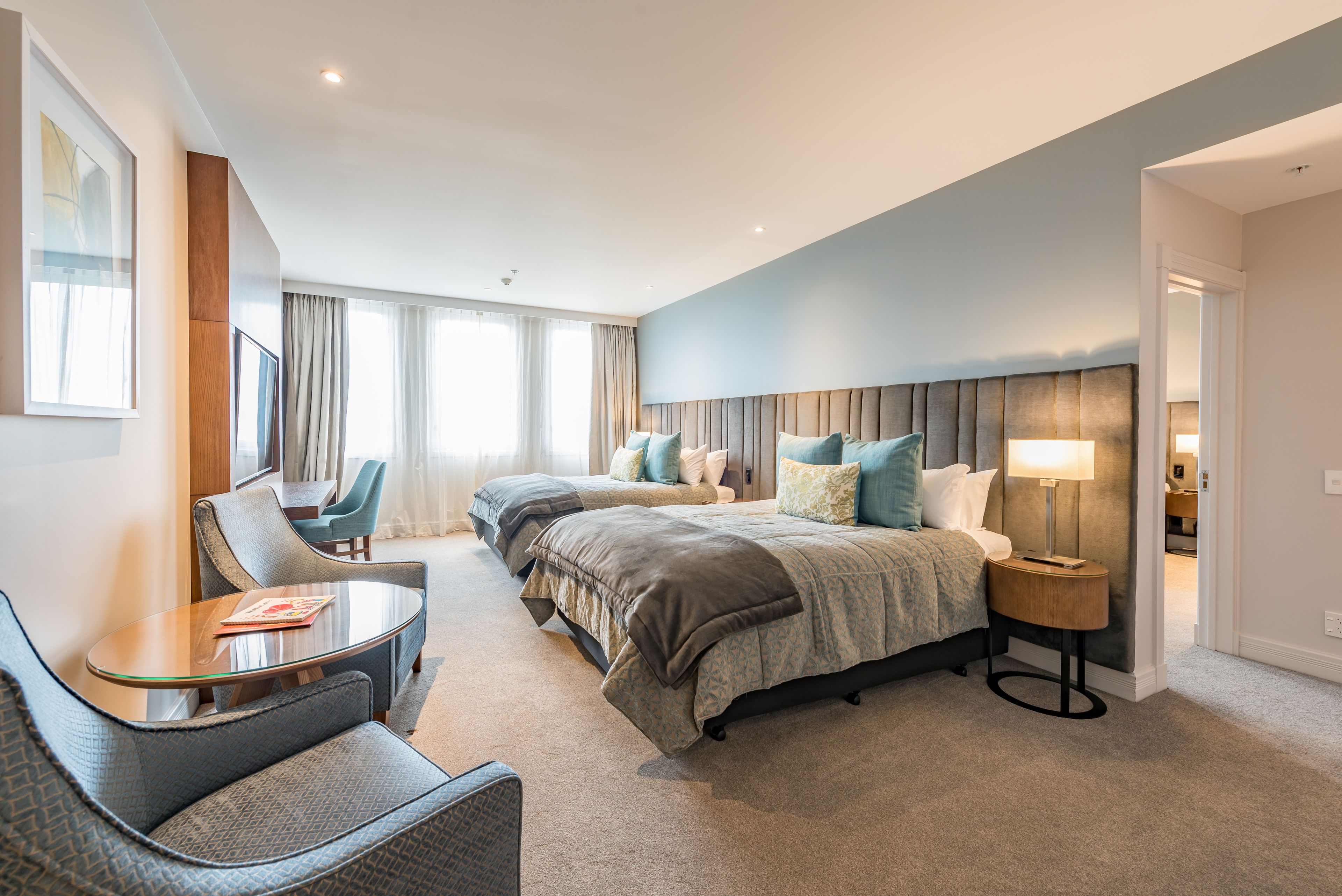 Superior Family Suite | Minibar, in-room safe, desk, iron/ironing board