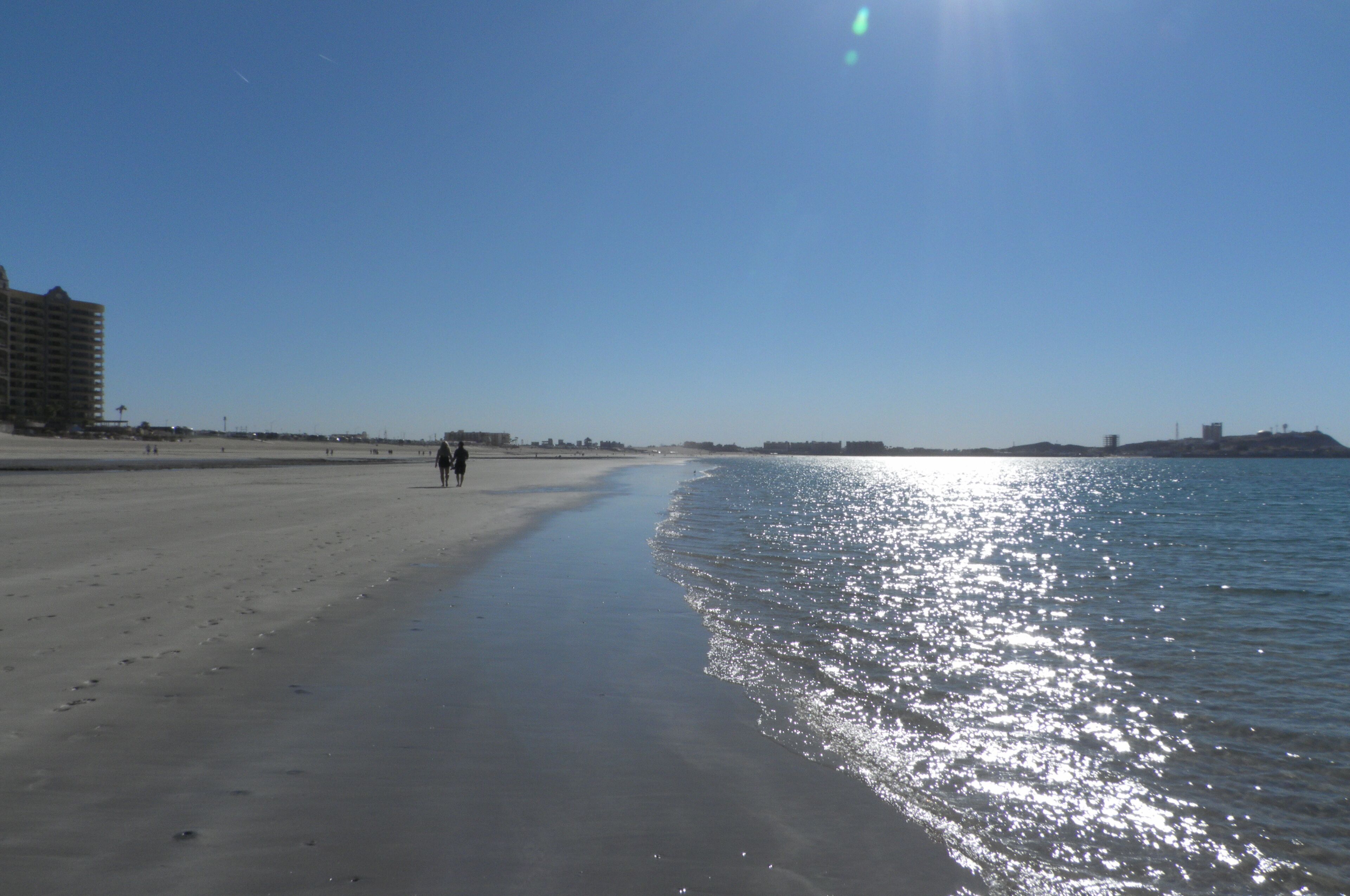 On the beach, sun-loungers, beach towels