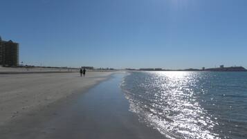 On the beach, sun-loungers, beach towels