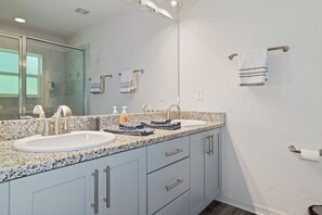 Combined shower/tub, hair dryer, towels, soap