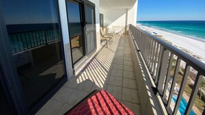 A balcony with a view of the beach and ocean. - "Breakers East 905"~Gulf Front 2 Bedroom/2 Bath Beach setup included (Destin)