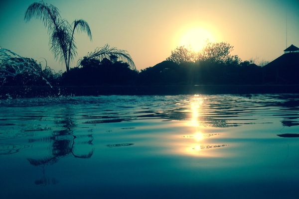 Swimming pool with the beautiful sundowner...