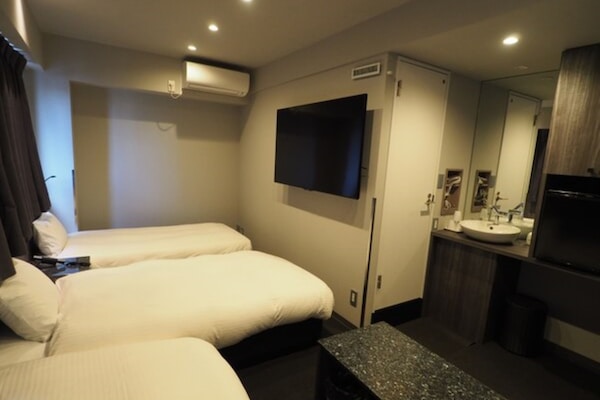 Triple Room | Desk, blackout drapes, iron/ironing board (on request), WiFi (free)