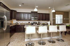 Coffee/tea maker, fridge, microwave, oven - 6BR Private Pool Home | No Rear Neighbors | Walk to Clubhouse | Near Disney (Kissimmee)