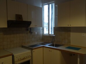 Fridge, oven, coffee/tea maker, cookware/dishes/utensils