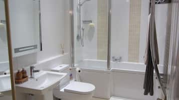 Bathtub, hair dryer, towels, soap