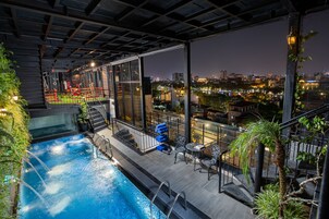 Outdoor pool, open 8:00 AM to 10:00 PM, pool loungers