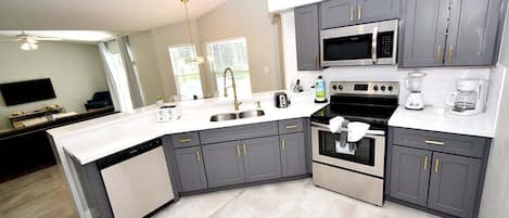 Coffee/tea maker, fridge, microwave, oven