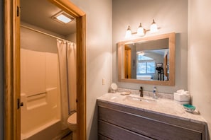 Upstairs Renovated Bathroom with Marble Countertops
