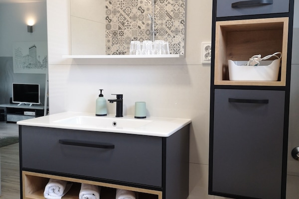Superior Apartment | Bathroom | Hair dryer, towels