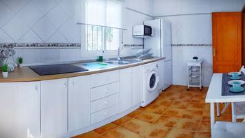 Een koelkast, een magnetron, een oven, een koffiezetapparaat/waterkoker