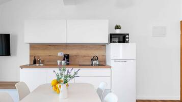 Fridge, microwave, stovetop, coffee/tea maker