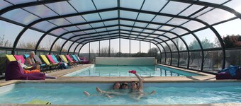 A two bedroom luxury lodge with extra cabin beds, heated covered pool