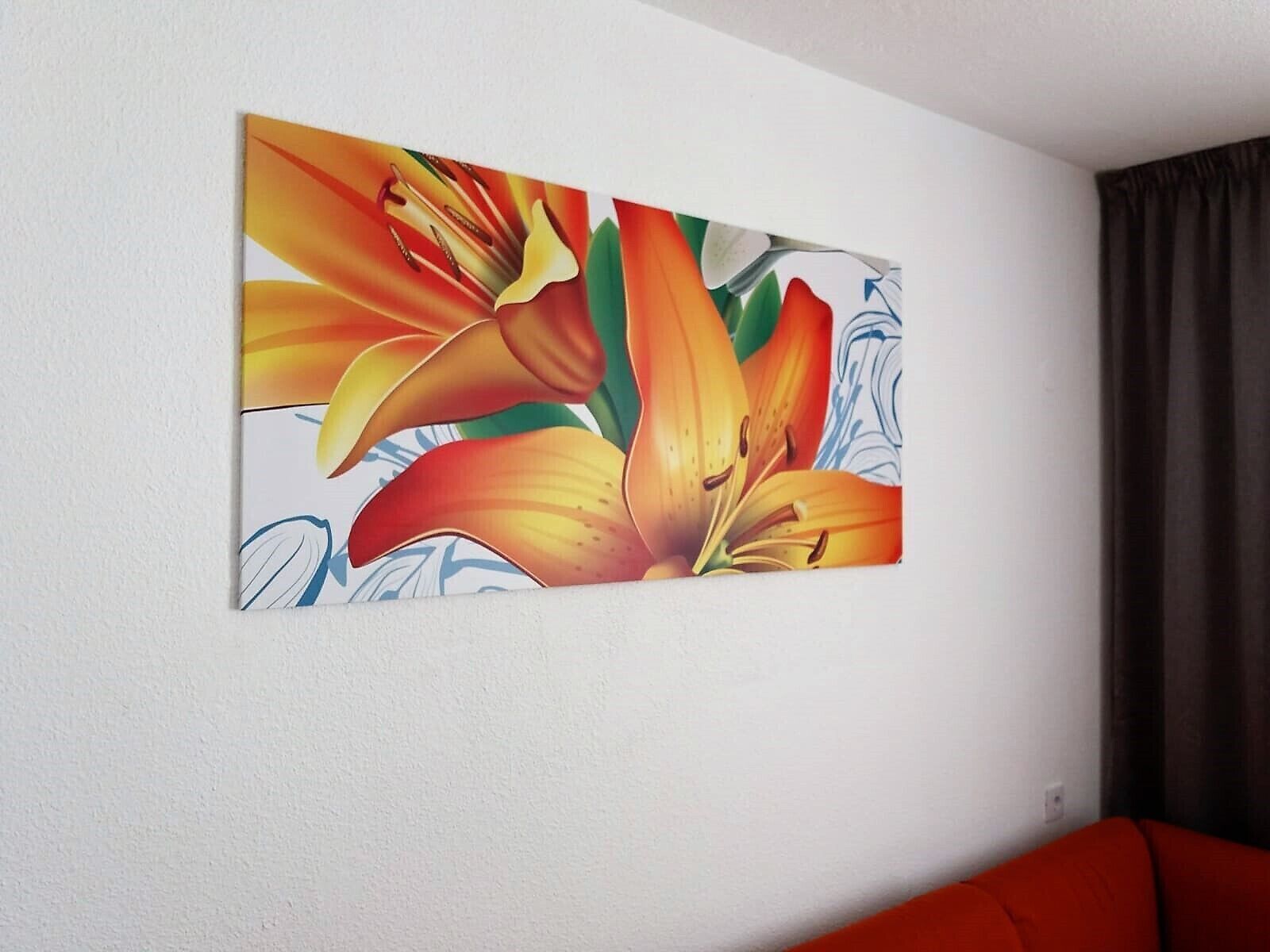 A painting of flowers on a white wall.