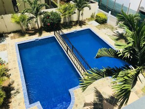 Outdoor pool, pool umbrellas, pool loungers