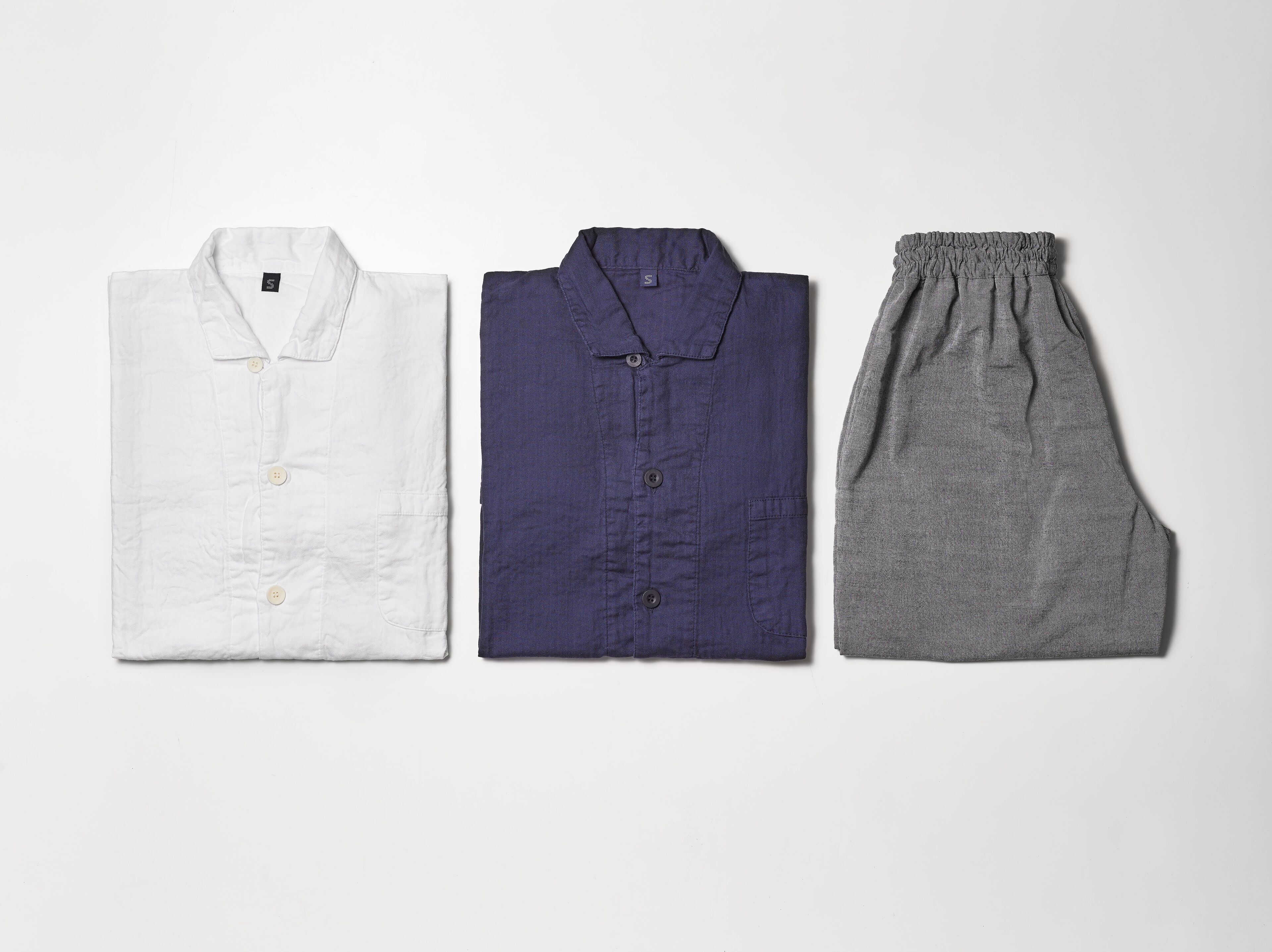Three pieces of clothing laid out on a surface.