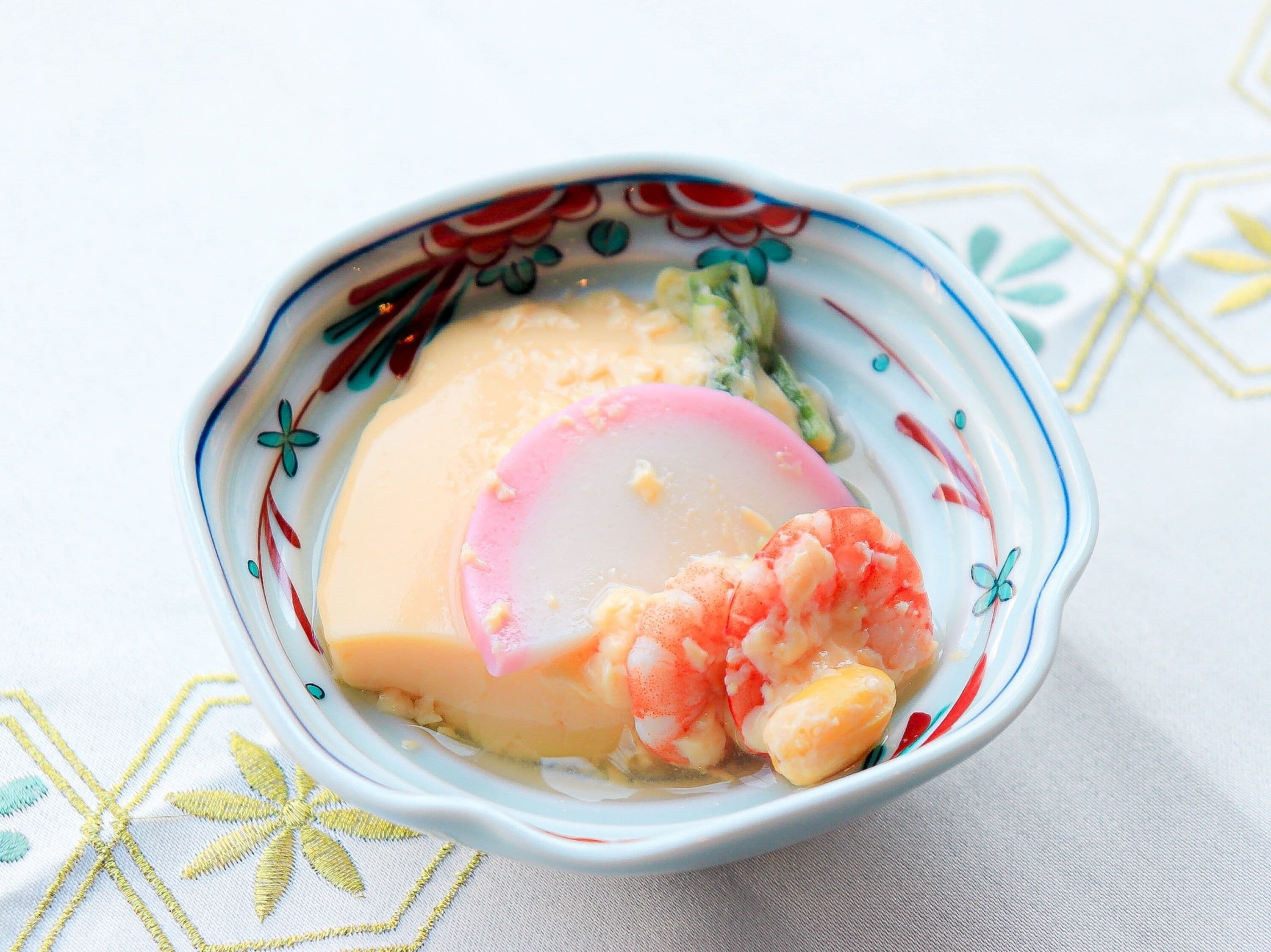 A bowl of food with a decorative pattern.