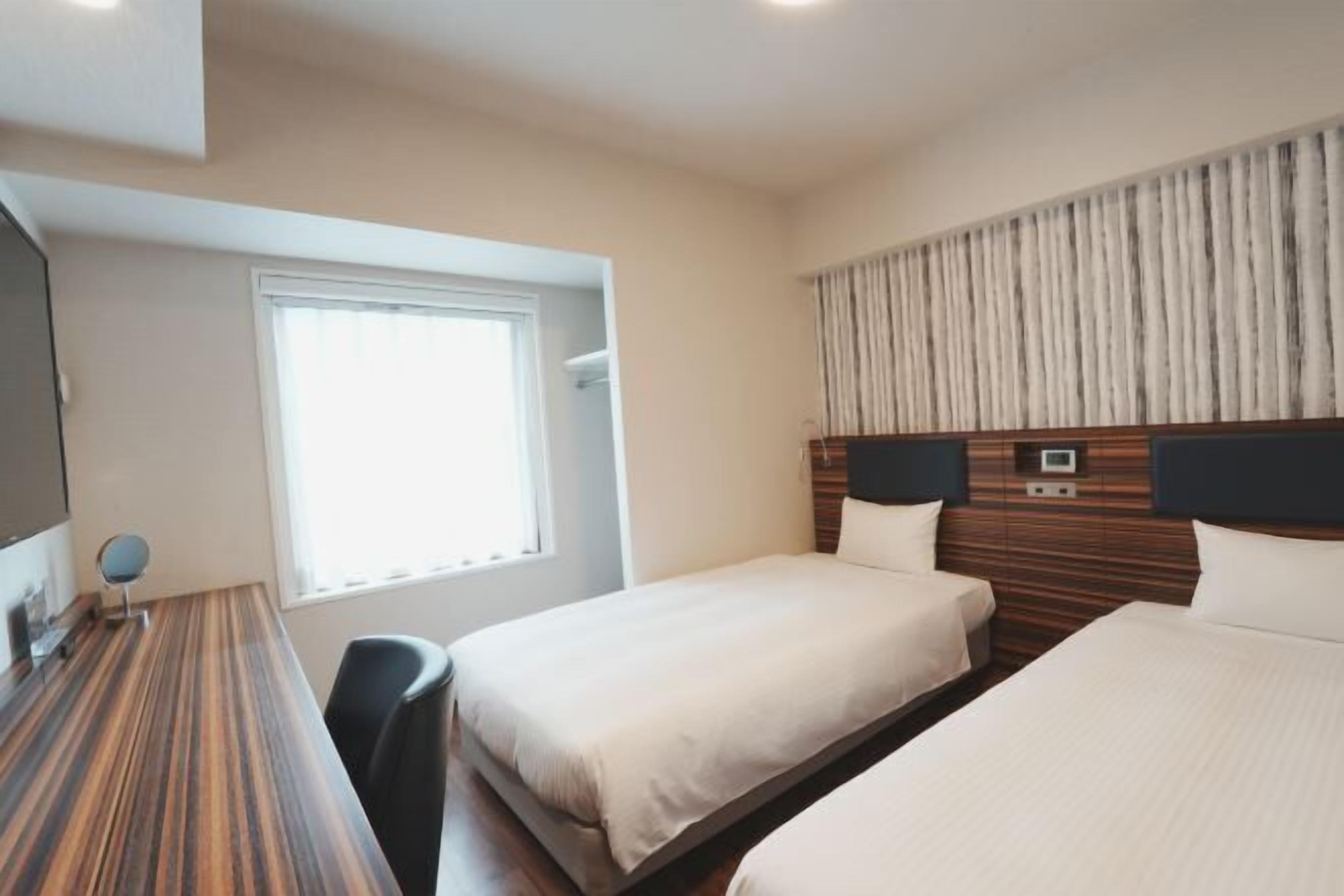 Down duvets, desk, laptop workspace, blackout curtains