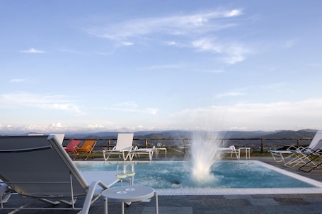Seasonal outdoor pool, open 9 AM to 6 PM, pool umbrellas, sun loungers