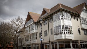 A multi-story building with a traditional architectural style, featuring a mix of rectangular and triangular roof shapes. - Toothbrush Apartments - Central Ipswich (Ipswich)