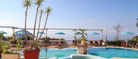 Indoor pool, outdoor pool, pool umbrellas, pool loungers