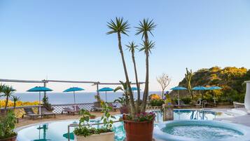 Indoor pool, outdoor pool, pool umbrellas, sun loungers