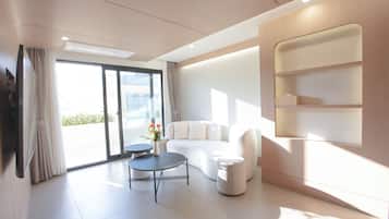 Presidential Studio Suite, Multiple Beds, Hot Tub | Living area | 65-inch flat-screen TV with cable channels, Netflix, heated floors