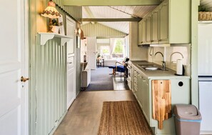 Fridge, stovetop, dishwasher, coffee/tea maker