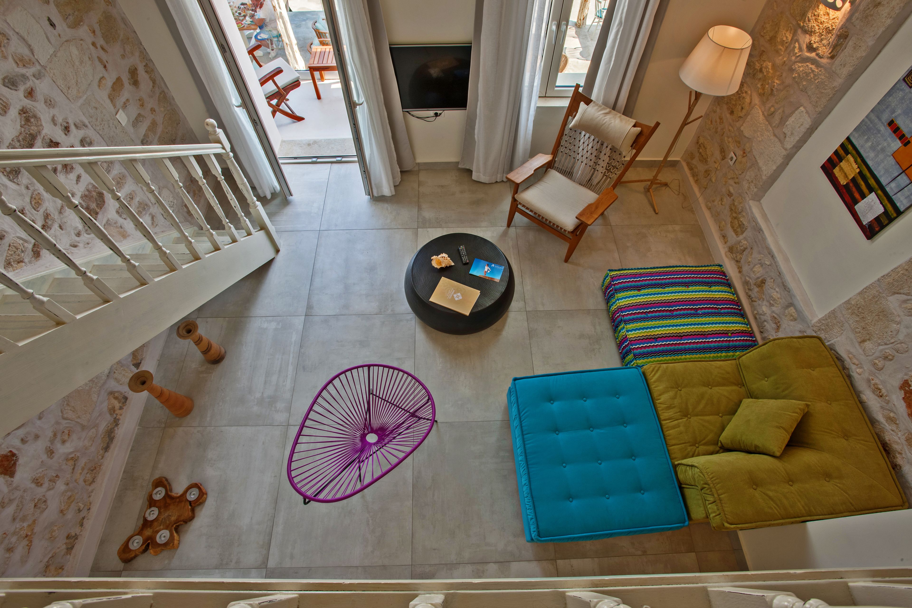 A spacious living area with a sofa, a coffee table, and a TV.