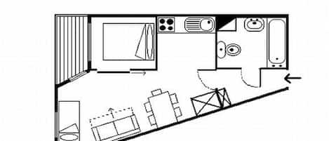 A floor plan of a hotel room with a bed, a desk, a chair, a wardrobe, and a bathroom.