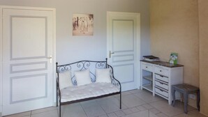 A bedroom with a bed, a desk, and two doors. - Large house with heated pool and spa in Manche (Savigny (Manche))