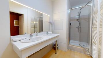 Bathtub, hair dryer, towels, soap