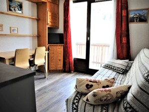 Work or dine in comfort with a desk and chair, enjoy a view from the window, and relax in a cozy bed with an outdoor access.