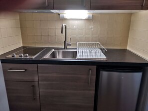 Fridge, microwave, stovetop, coffee/tea maker