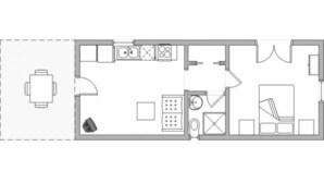 A floor plan of a hotel room with a bed, a desk, a chair, a small table, a sofa, and a bathroom with a toilet and sink.