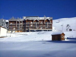 Stunning hotel with a traditional facade, featuring evenly spaced windows and balconies.