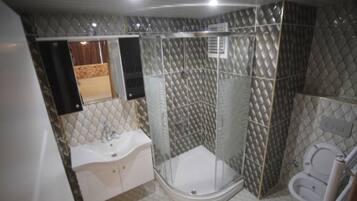 Shower, free toiletries, hair dryer, slippers