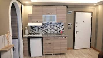 Studio Apartment | Area keluarga | TV LED