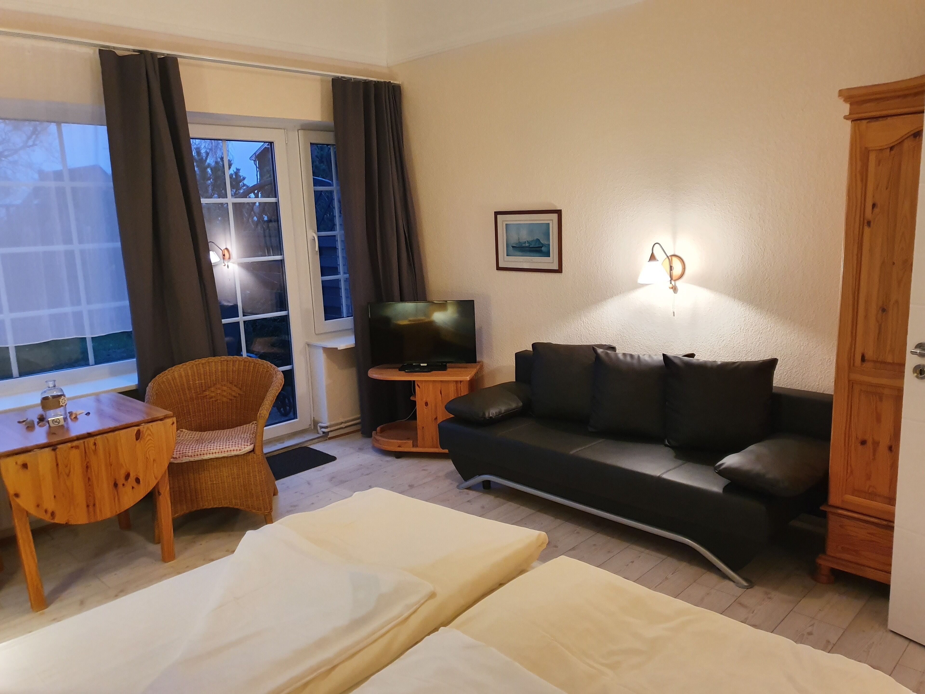 basic apartment, kitchenette, garden area | living area | 32-inch flat-screen tv with satellite channels, tv