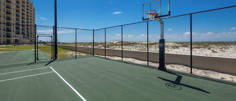 Play a game of basketball with stunning beach views just steps away from your rental at Phoenix X in Orange Beach