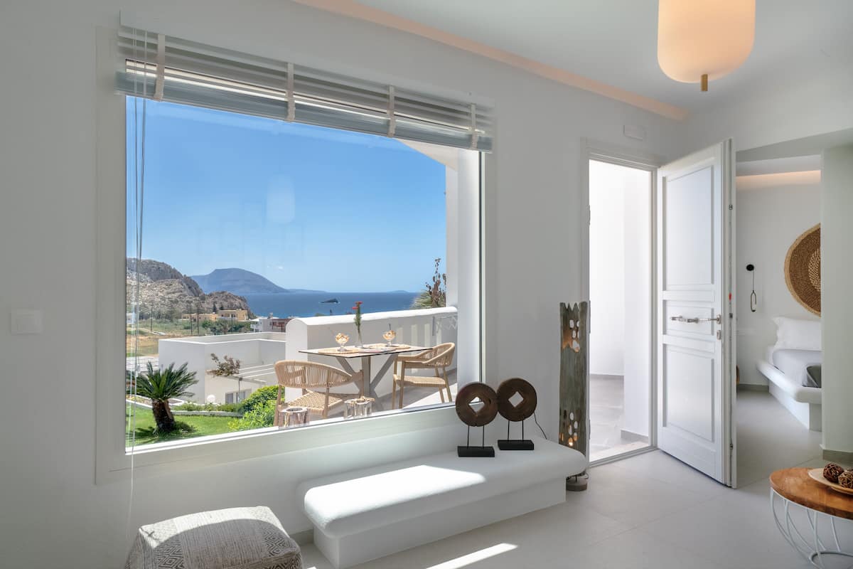 Junior Suite, Sea View | Living area | TV