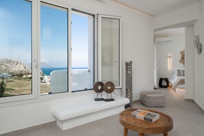 Junior Suite, Sea View | Living area | TV