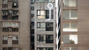 A multi-story building with numerous windows and air conditioning units. - Just Inn - City Hall (Taipei)